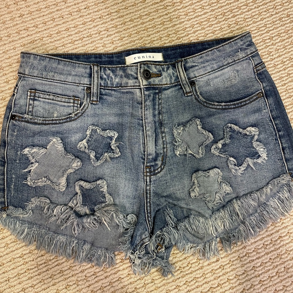 Jean shorts with stars. Size medium.